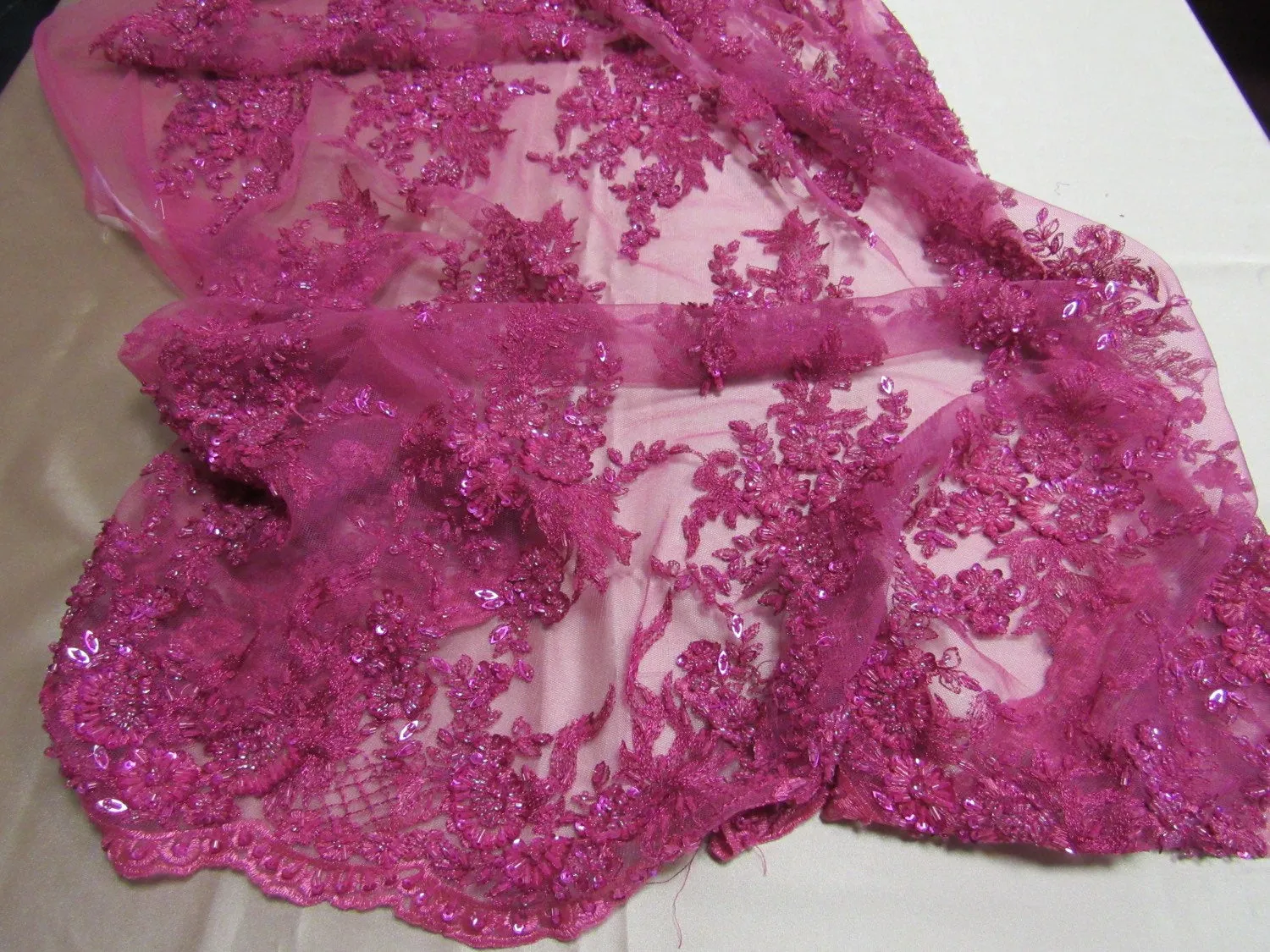 Gorgeous fuchsia/magenta French floral  design embroider and beaded on a mesh lace. Wedding/Bridal/Prom/Nightgown fabric-sold by yard.